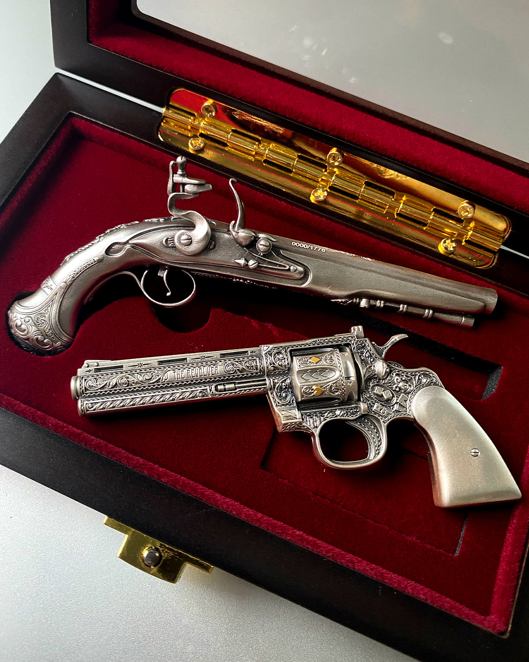image of the revolver and george washington's flintlock pistol 2 oz silver coins