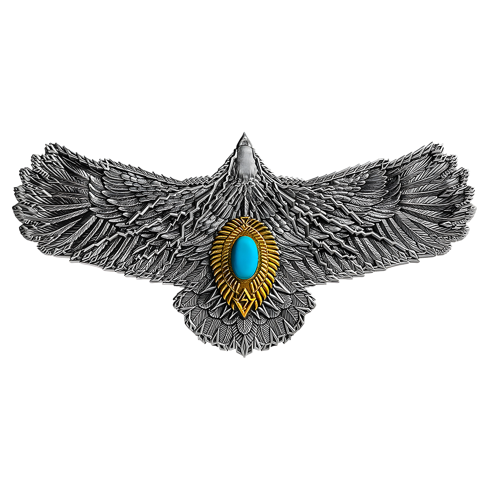 Pure silver Thunderbird coin with winged design and a turquoise oval center gem