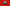 Collectible baseball cap with raised front text and small flag patch, shown on red background.