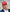 Red cap with white raised slogan text, curved brim, and ventilation eyelets